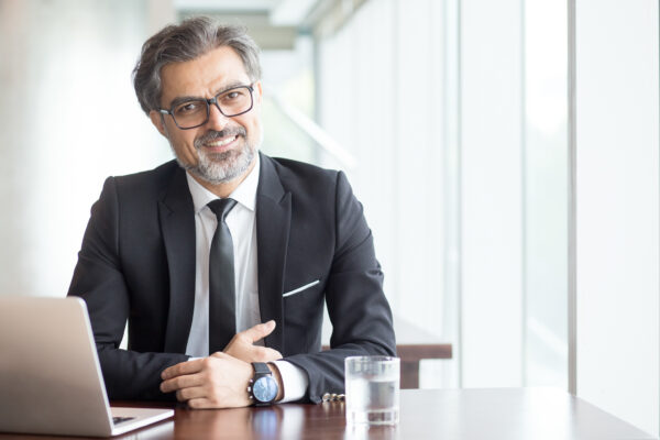 Cheerful Businessman In Eyeglasses In Office