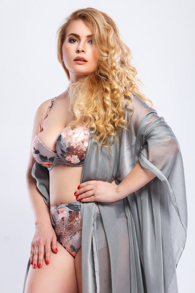 Beautiful Plus Size Model Wearing Lingerie And Piece Fabric